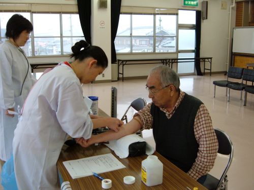 Nurse collecting blood sample