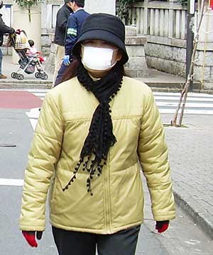 Woman wearing surgical mask in Japan